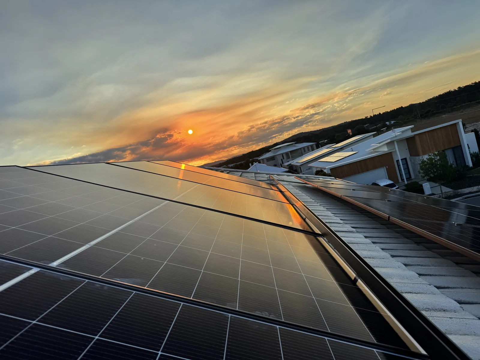 Rooftop solar array at sunset on a new home at Aura