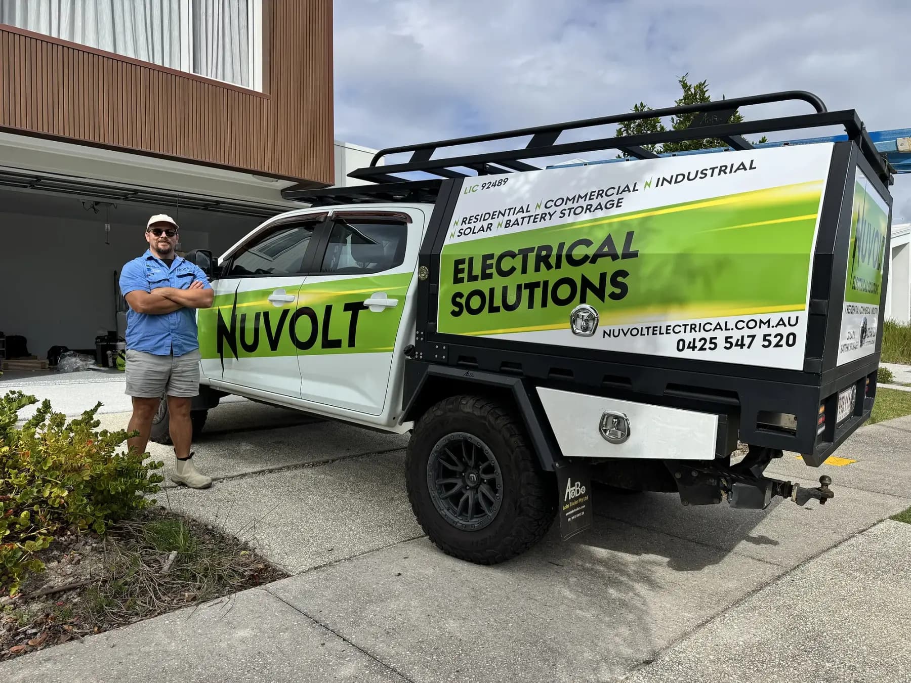 Daniel from Nuvolt Electrical beside the fully wrapped Nuvolt ute, a licensed electrical contractor serving the Sunshine Coast and Brisbane